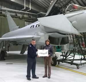 Sgt Stuart Smylie, presenting me with a print of the Typhoon behind me, signed by crew of II (AC) Squadron. 